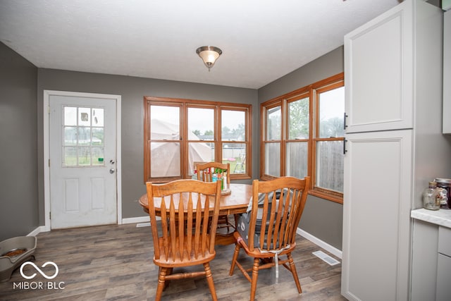 dining area featuring hardwood / wood-style flooring