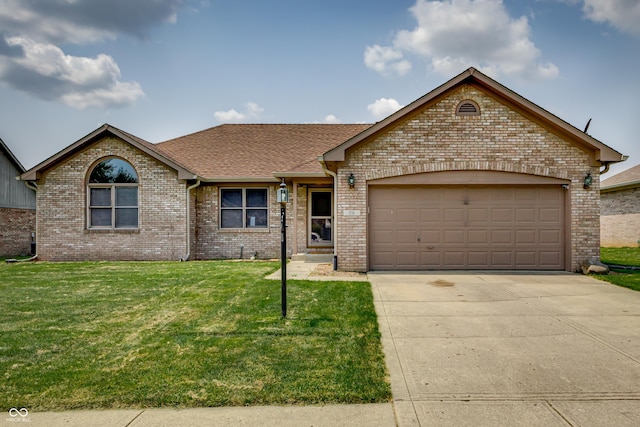 ranch-style house with a garage and a front lawn