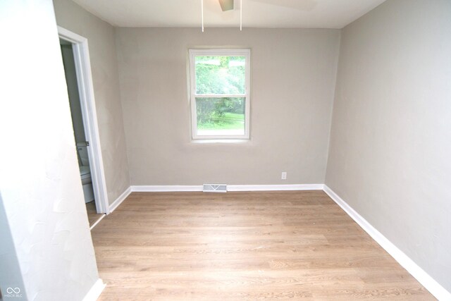 empty room featuring ceiling fan and light wood-type flooring