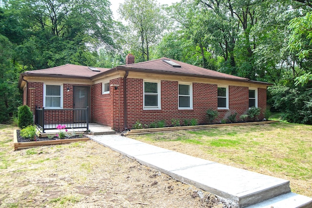 ranch-style home with a front yard