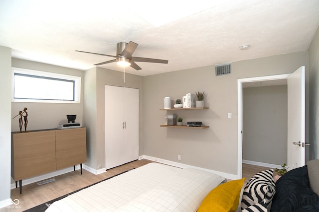 bedroom with ceiling fan and light hardwood / wood-style flooring