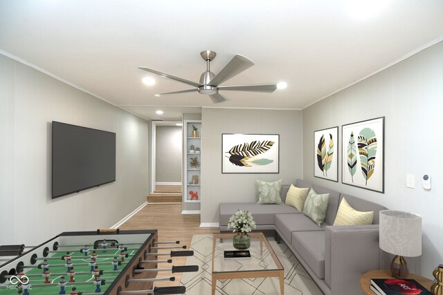 living room featuring light hardwood / wood-style flooring, ornamental molding, and ceiling fan