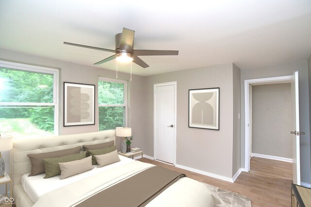 bedroom featuring hardwood / wood-style floors and ceiling fan