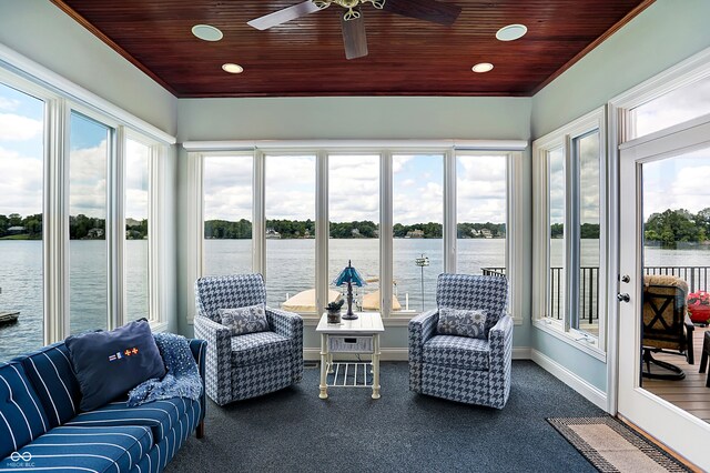 sunroom with a water view and a wealth of natural light