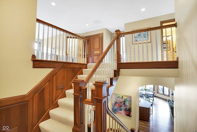 staircase featuring hardwood / wood-style flooring