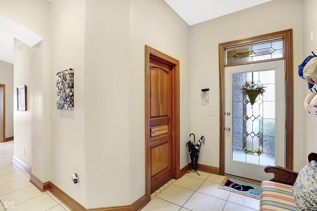 entryway with light tile patterned floors