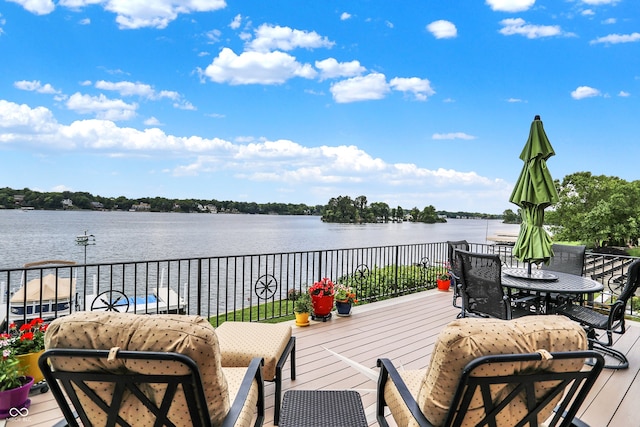 wooden deck with a water view