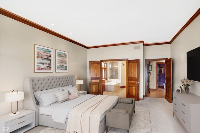 carpeted bedroom featuring crown molding and ensuite bathroom