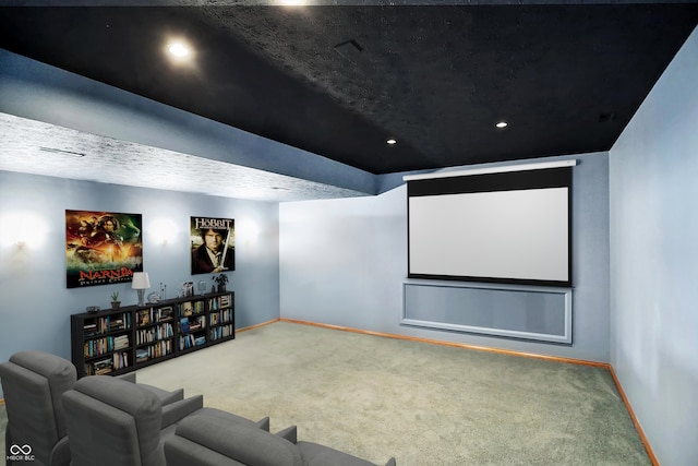 home theater featuring carpet floors and a textured ceiling