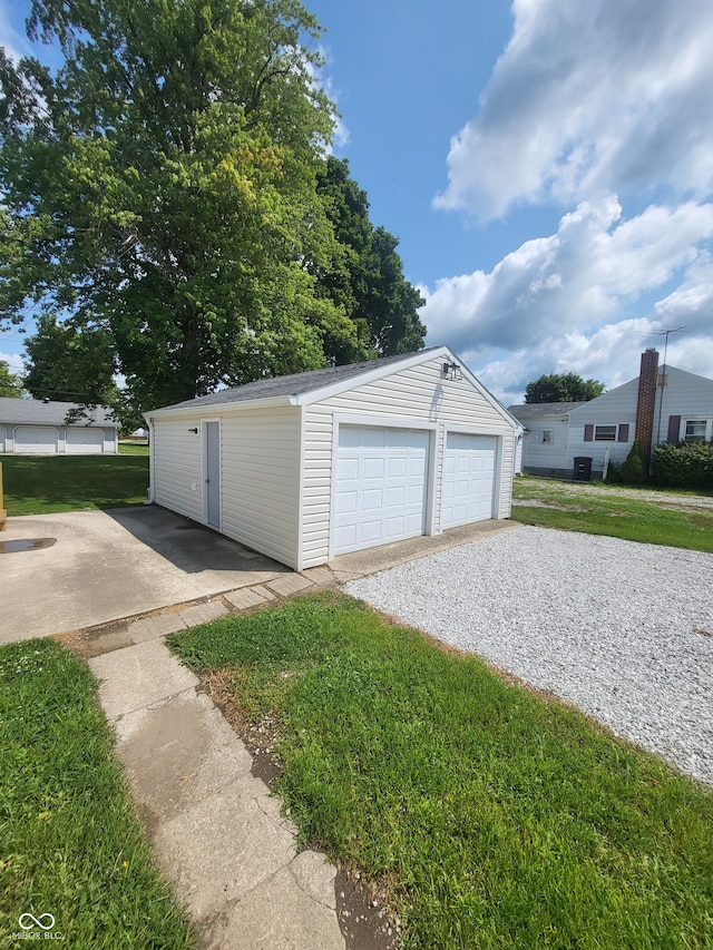 garage featuring a yard