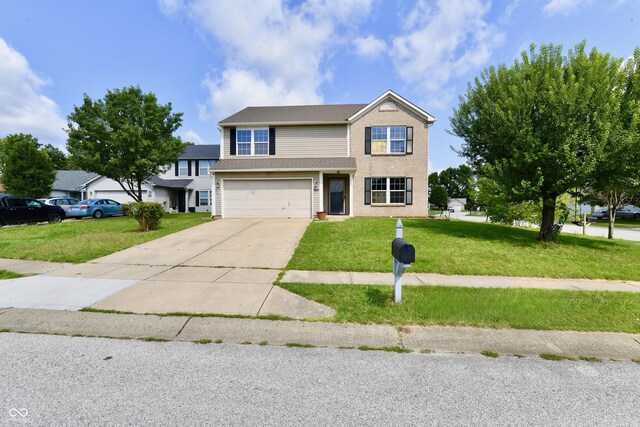 view of front facade with a garage and a front lawn