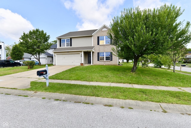 view of front of house with a garage and a front yard