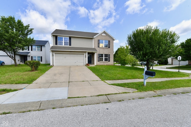 view of front of home featuring a garage and a front yard