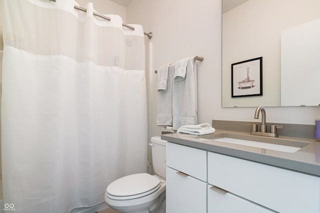 bathroom with toilet and vanity