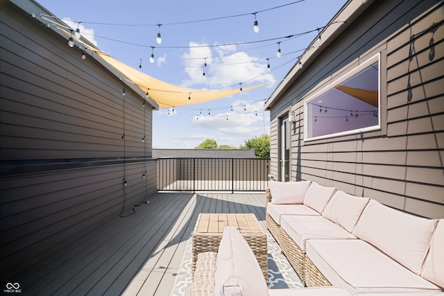 wooden deck featuring outdoor lounge area