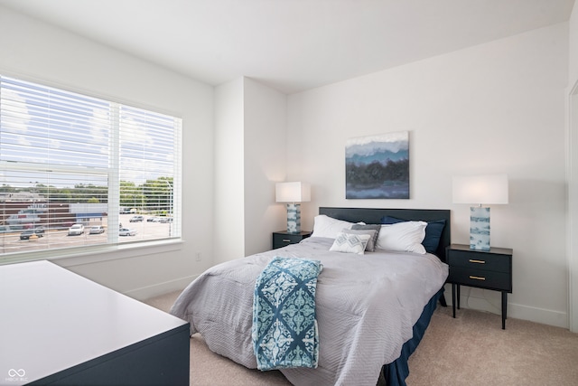 bedroom with light colored carpet