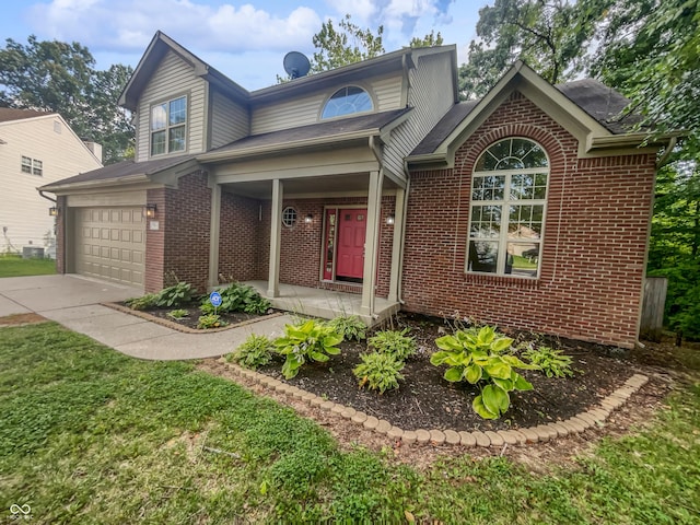 view of front of property featuring a garage and a porch