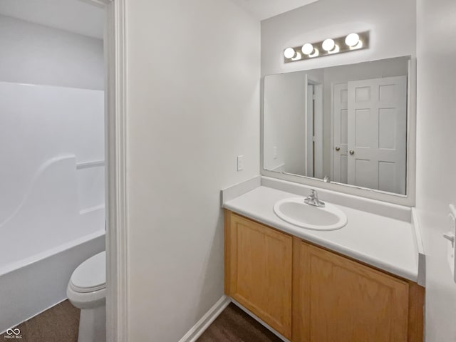 bathroom featuring vanity and toilet