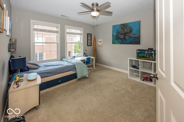 carpeted bedroom featuring ceiling fan