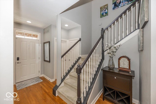 foyer with wood-type flooring