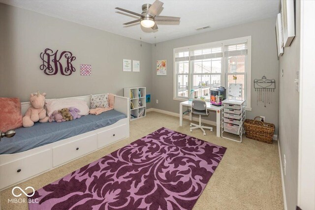 bedroom with light carpet and ceiling fan