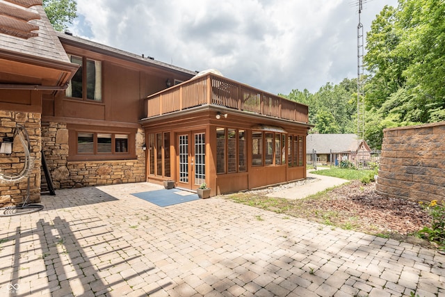 rear view of house featuring a patio area