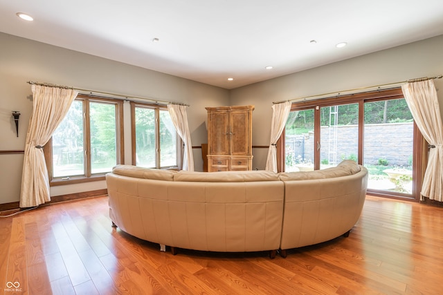 living area featuring light wood-style floors and recessed lighting