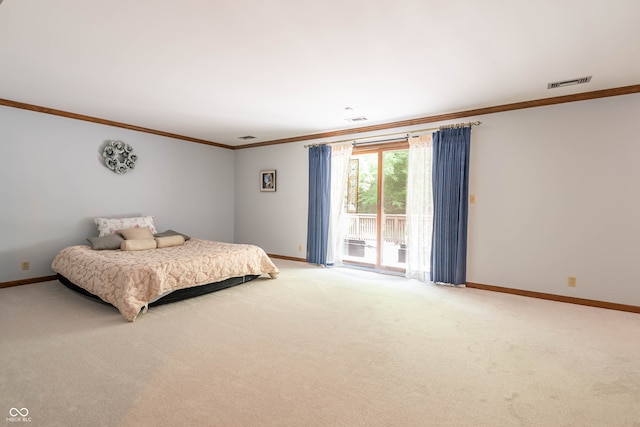 bedroom featuring visible vents, crown molding, baseboards, and access to outside