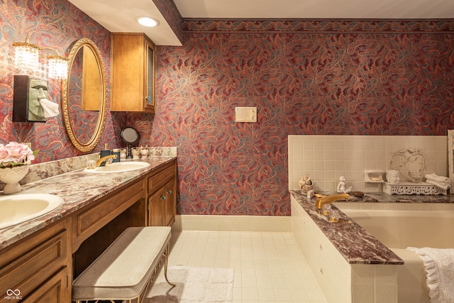 bathroom featuring double vanity, tile patterned flooring, and a tub