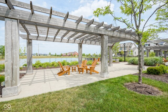 exterior space with a pergola and a water view