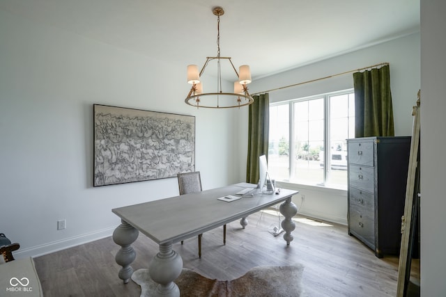 office space featuring hardwood / wood-style floors and an inviting chandelier