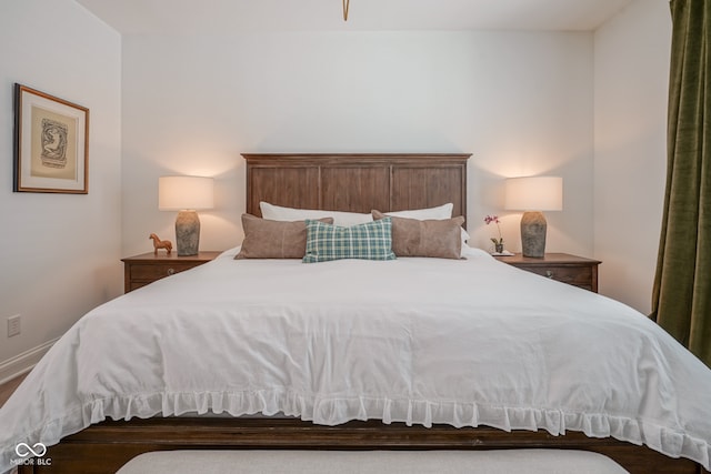 bedroom with wood-type flooring