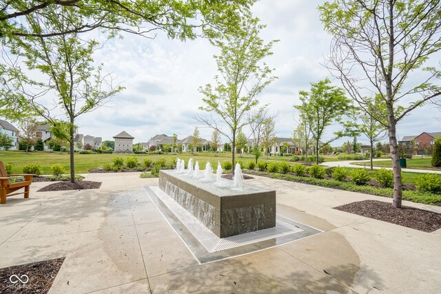 view of home's community featuring a lawn