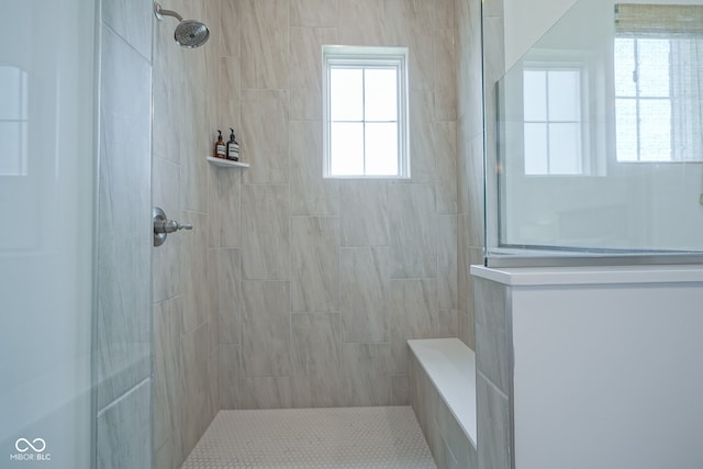 bathroom with tiled shower