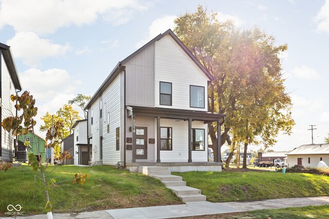 view of front facade with a porch and a front yard