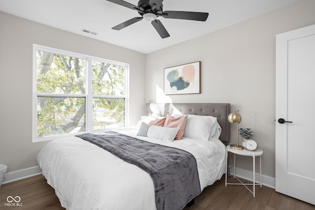 bedroom featuring dark wood-type flooring and ceiling fan