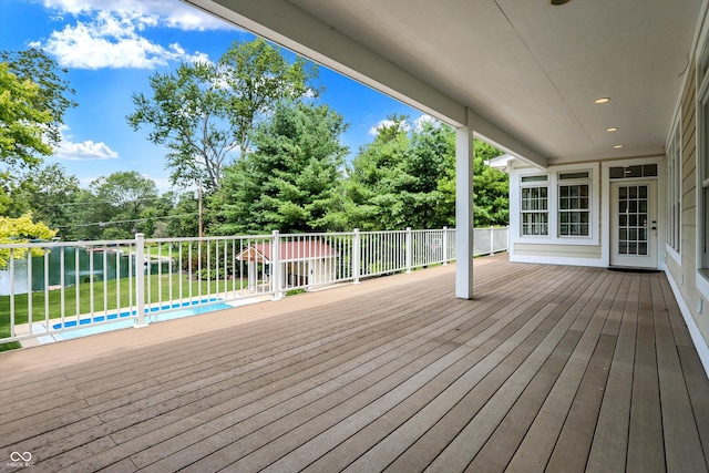 deck featuring a water view and a yard