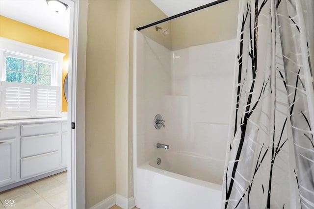 full bathroom featuring tile patterned flooring and shower / bathtub combination with curtain