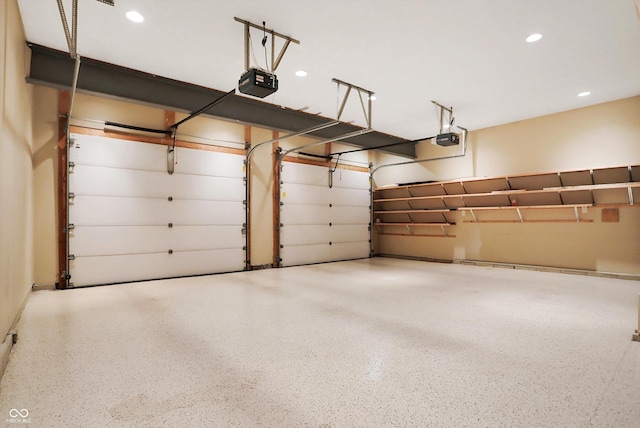 garage featuring recessed lighting and a garage door opener