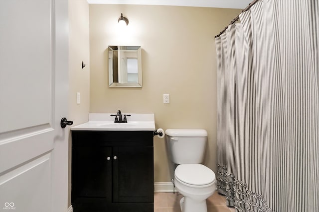 bathroom with curtained shower, vanity, toilet, and tile patterned floors