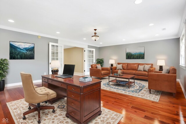 office with ornamental molding, french doors, and light wood-type flooring