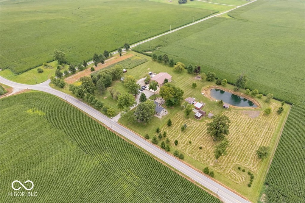 birds eye view of property featuring a rural view and a water view