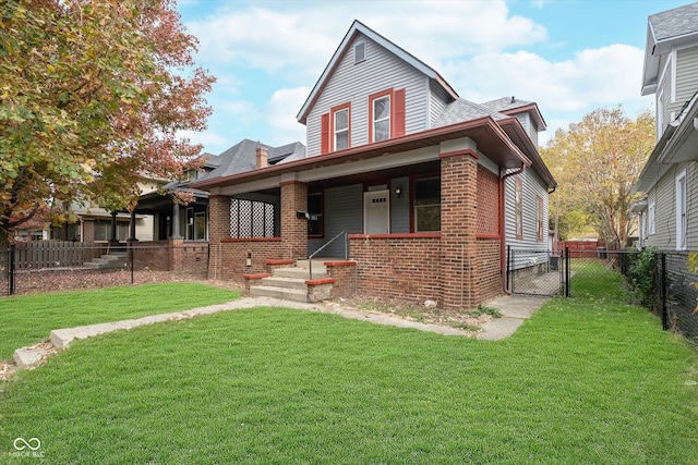 view of front of house with covered porch and a front lawn