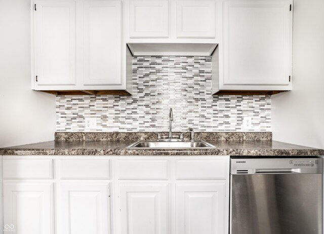 kitchen featuring white cabinets, sink, tasteful backsplash, and dishwasher