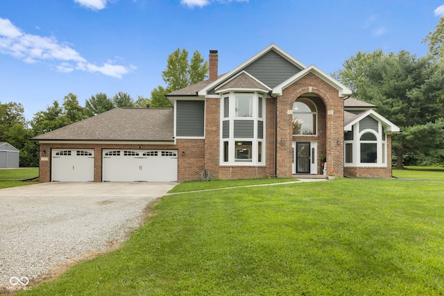 view of property with a garage and a front yard