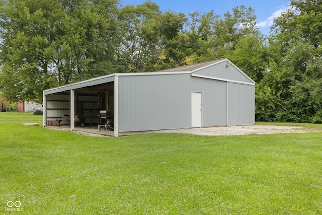 view of outbuilding featuring a lawn