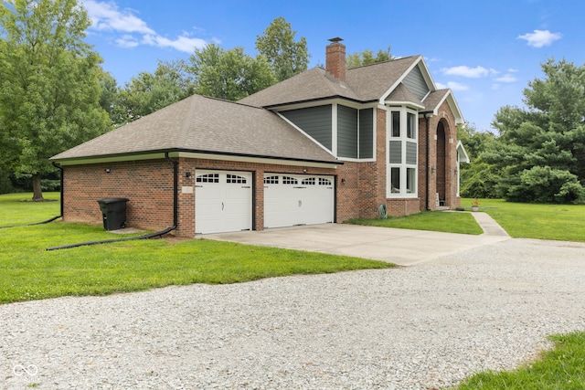 view of front of house featuring a front yard and a garage