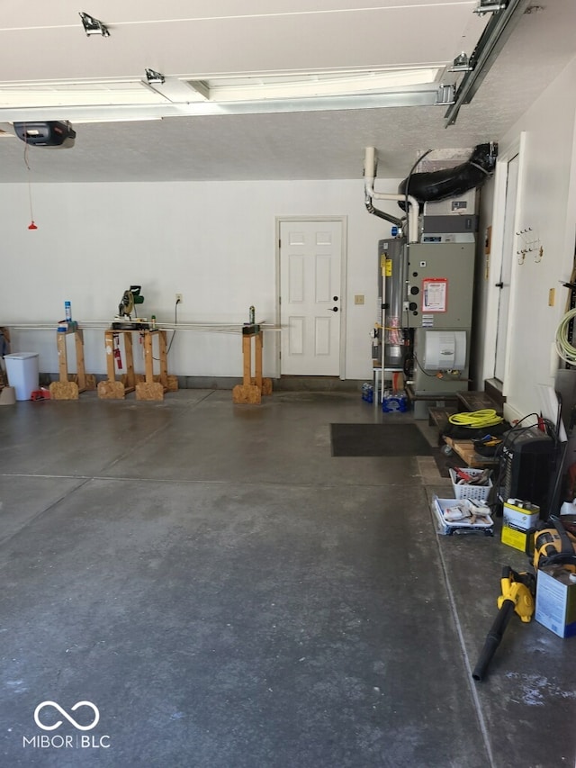 garage featuring a garage door opener, water heater, and heating unit