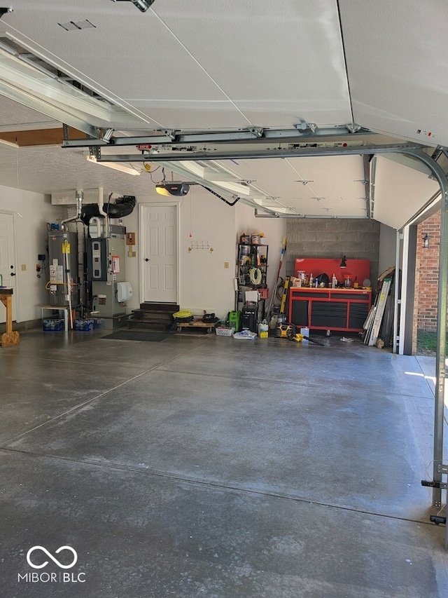 garage with gas water heater and heating unit