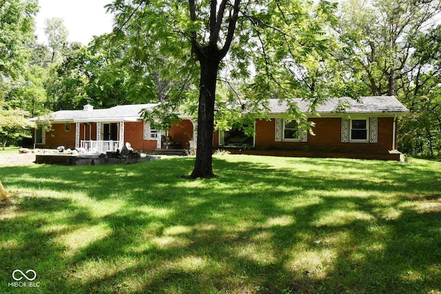 view of yard with covered porch